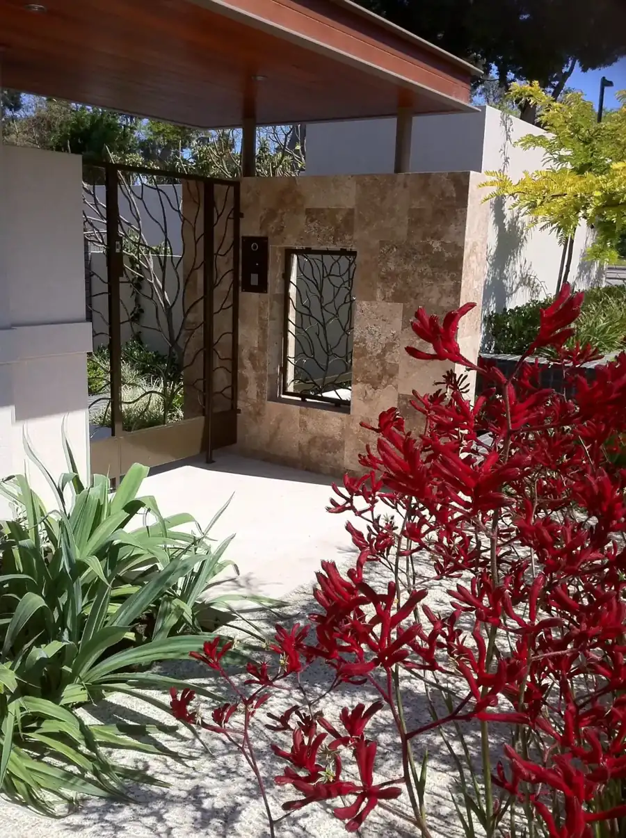 Outdoor travertine feature wall and entry